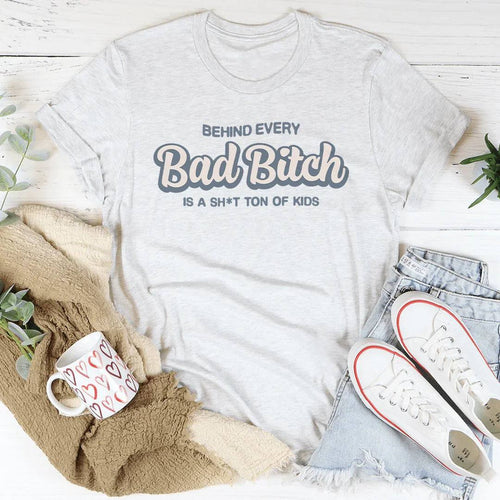 Black women's sweatshirt with "Behind Every B-tch Is A S-it Ton Of Kids" bold white text, soft relaxed fit mom tee
