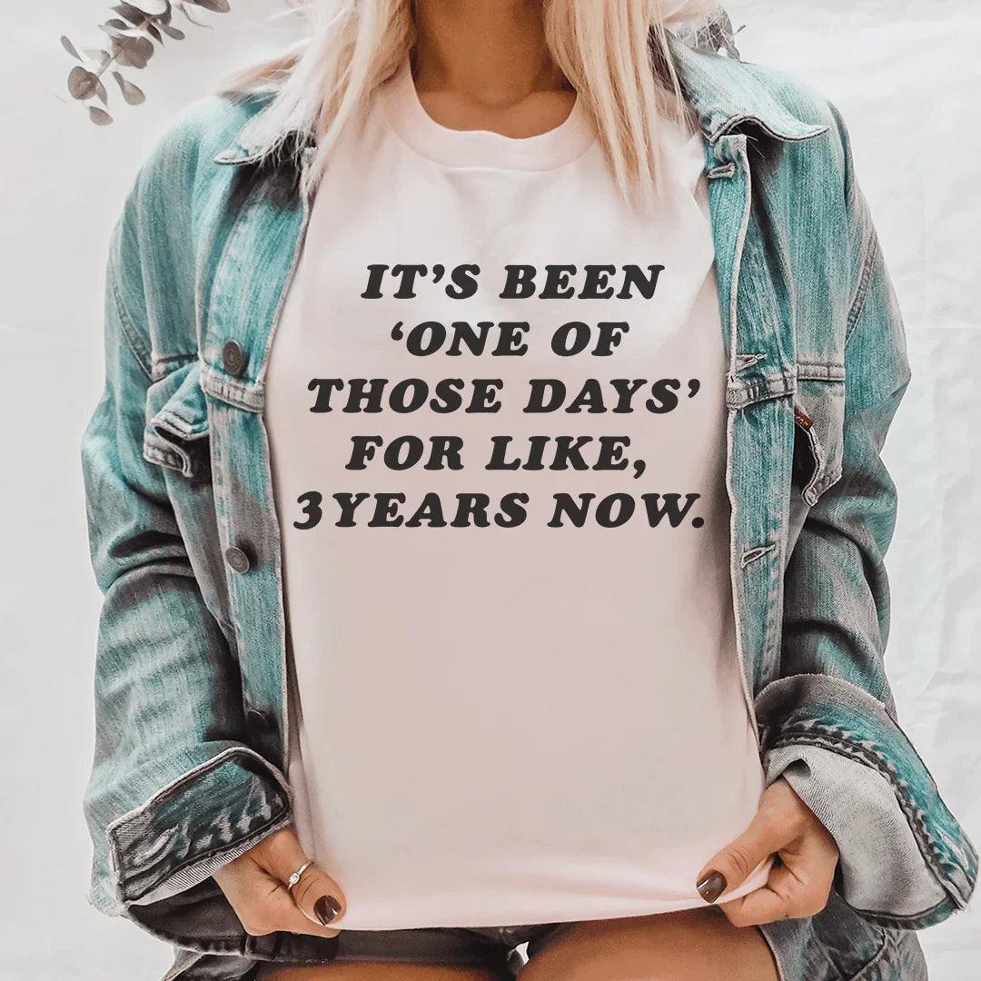 Woman wearing a soft cotton "It's Been One Of Those Days Tee" with a funny slogan, styled for casual comfort and everyday sass.