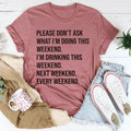 Woman wearing a white Please Don't Ask What I'm Doing This Weekend Tee with bold black text, casual and comfortable fit