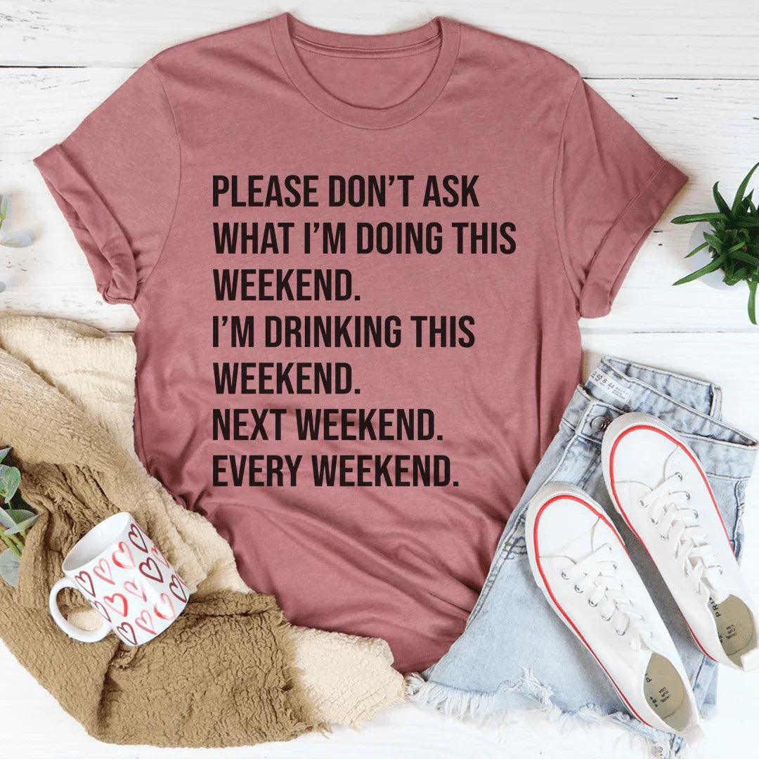 Woman wearing a white Please Don't Ask What I'm Doing This Weekend Tee with bold black text, casual and comfortable fit