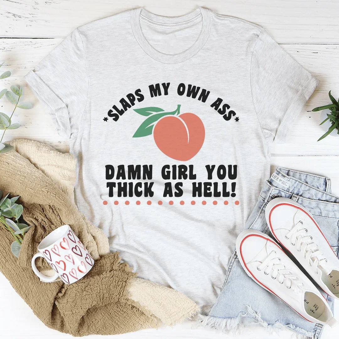 Black Thick As Hell Tee with bold white lettering, soft lightweight cotton, styled casually